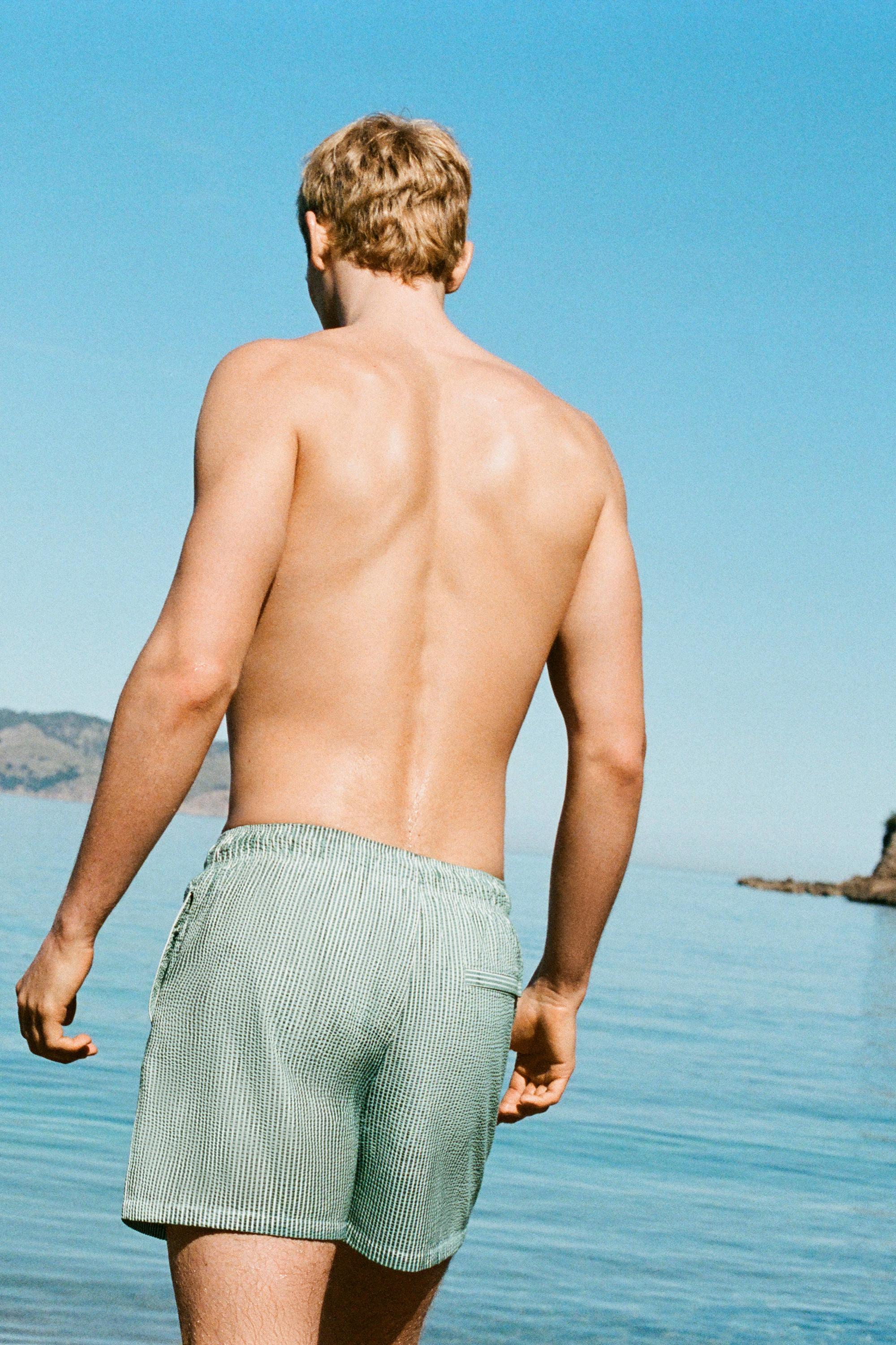 Striped seersucker swimming trunks — Green