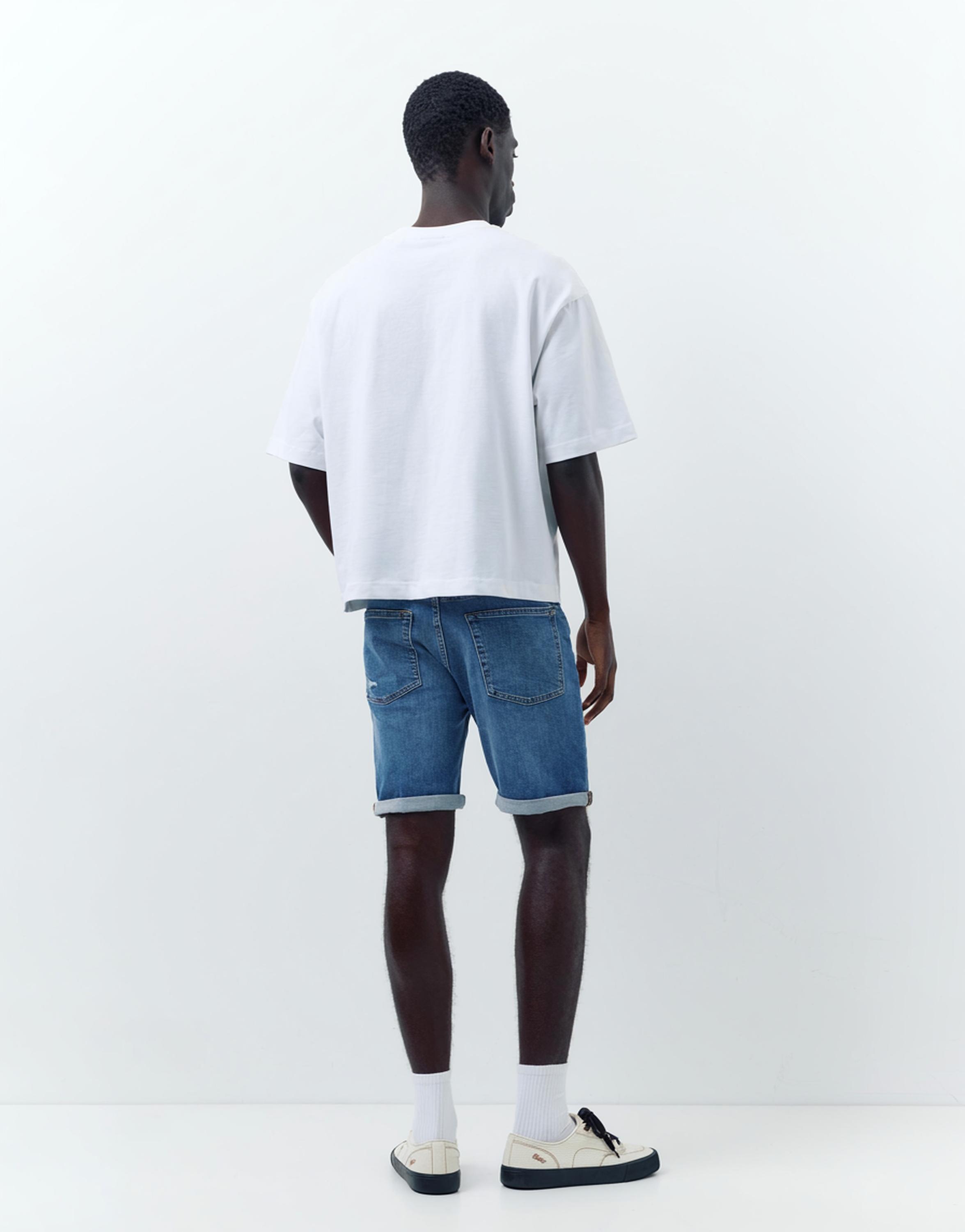 Ripped denim Bermuda shorts — Medium blue