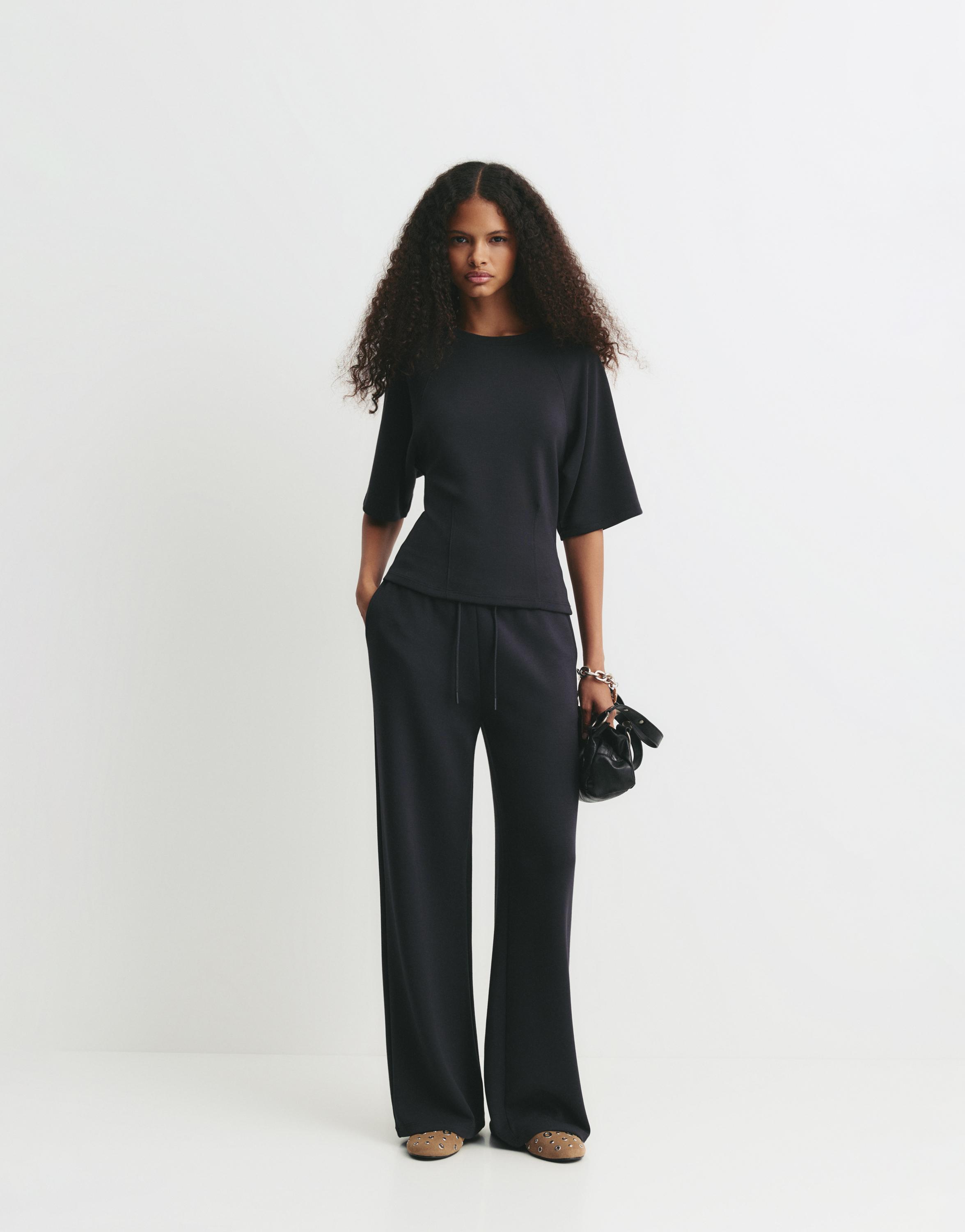 Soft-touch wide-leg trousers — Black