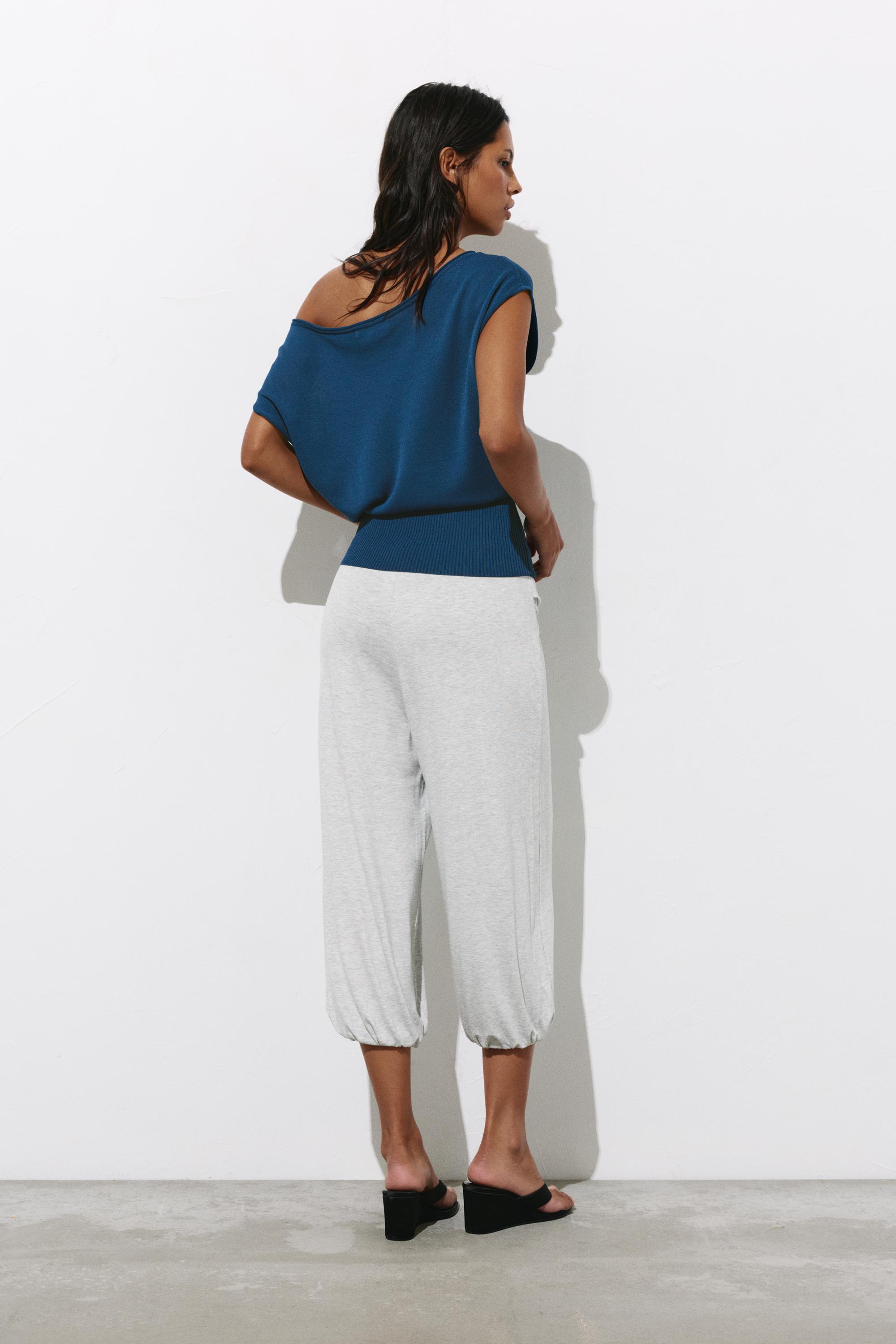 Short sleeve asymmetric knit top — Indigo