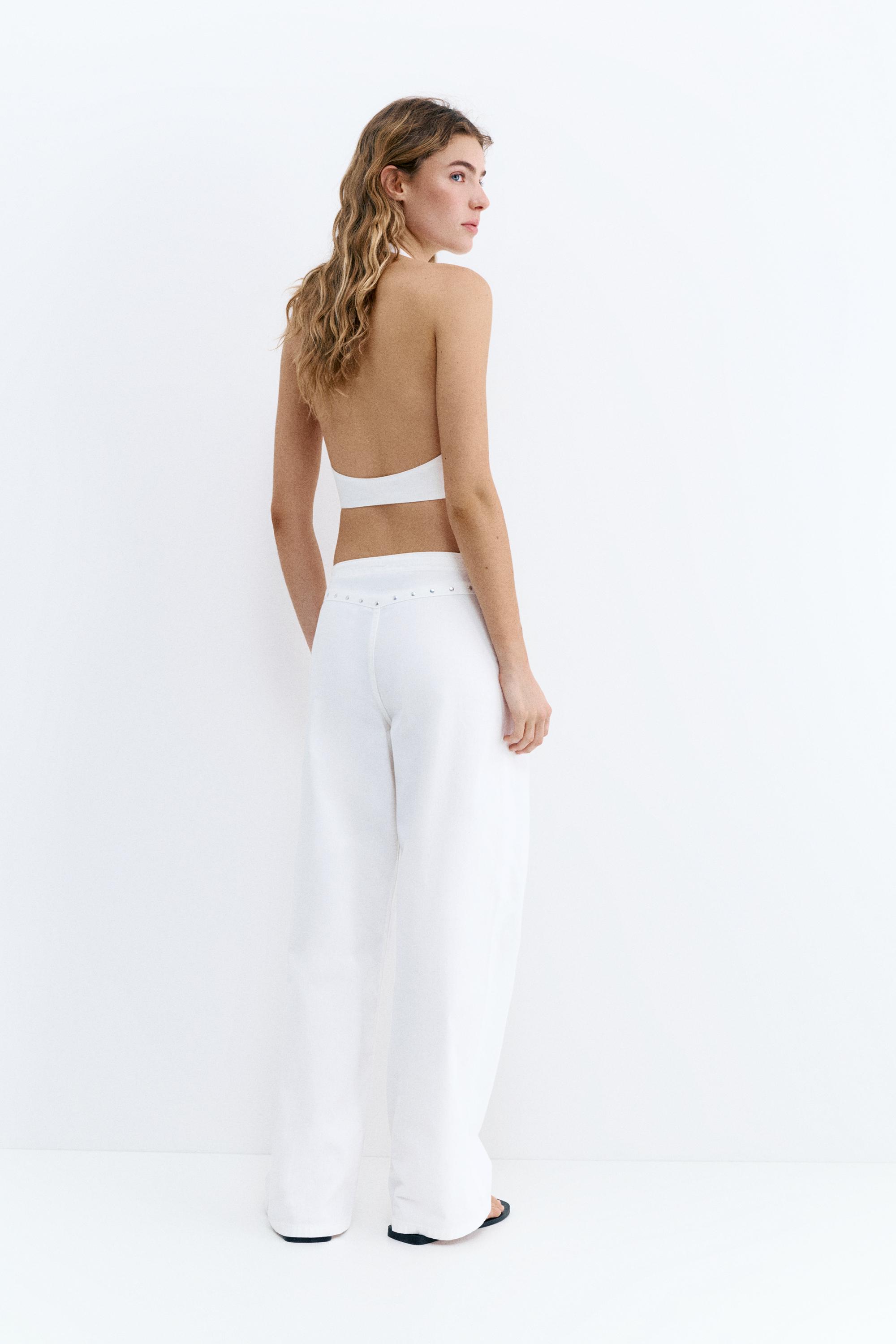 White studded baggy jeans — White