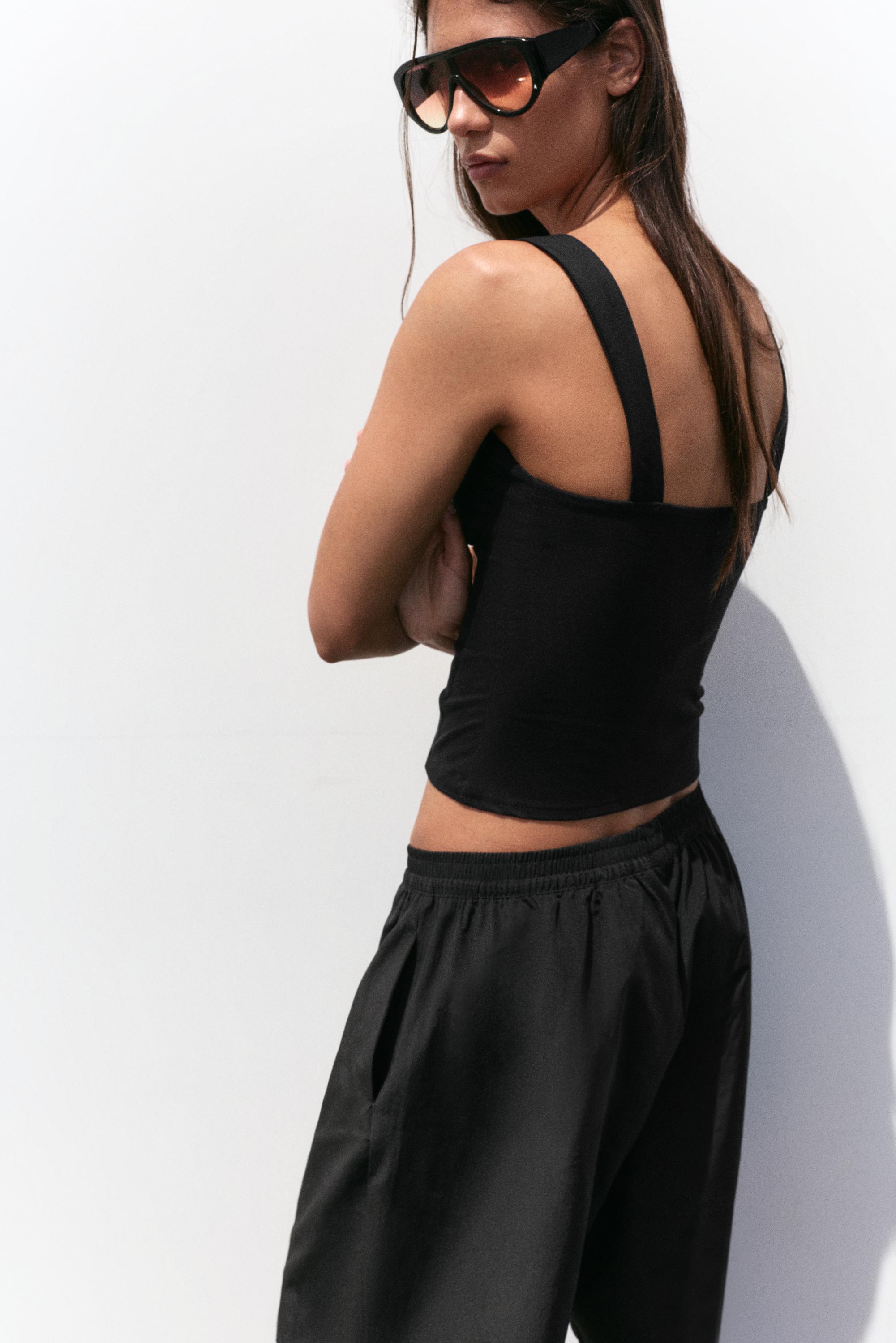 Strappy corsetry-inspired top — Black
