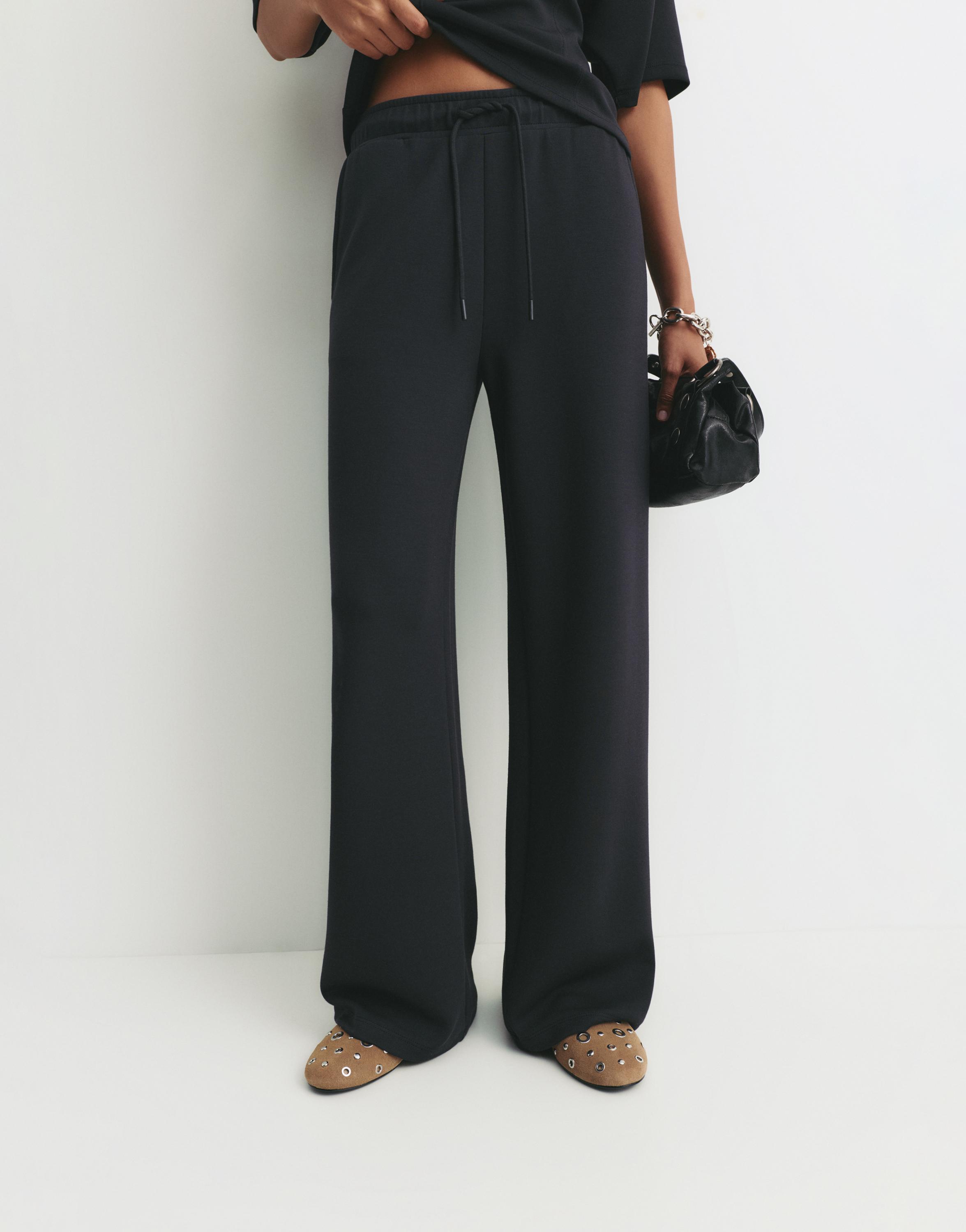 Soft-touch wide-leg trousers — Black