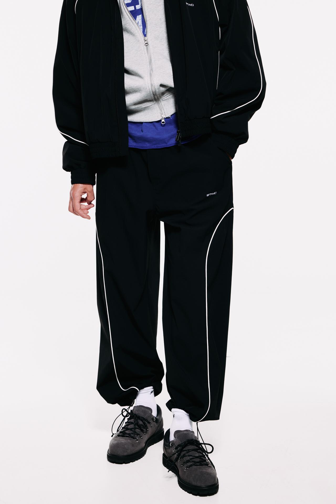 Technical jogger trousers with piping — Black