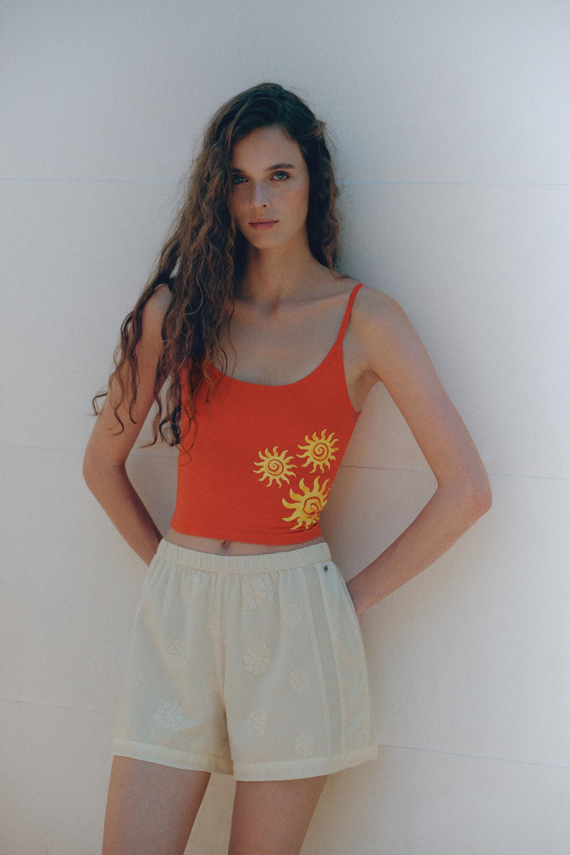 Orange sun graphic top — Red