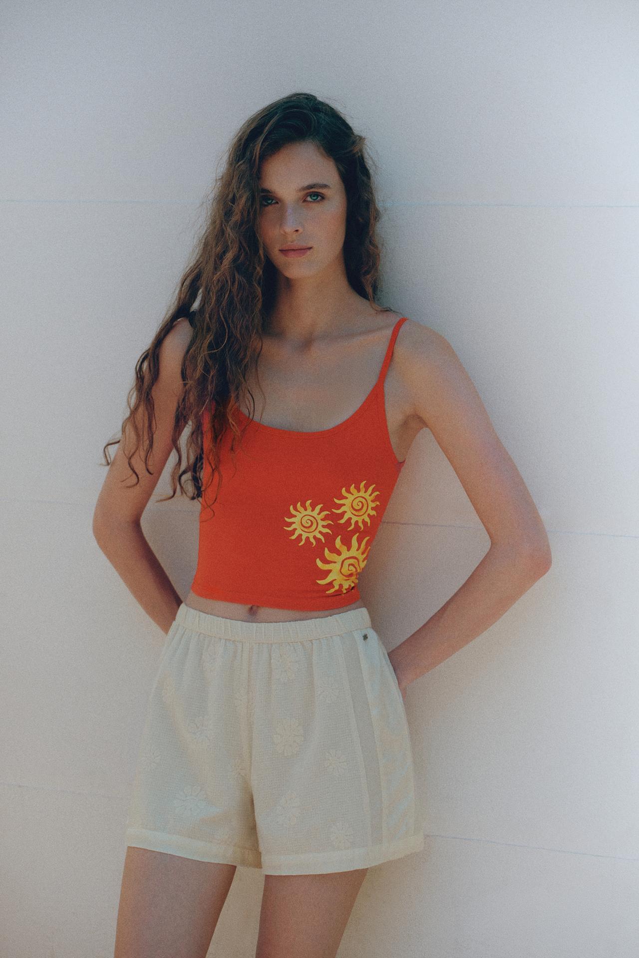 Orange sun graphic top — Red