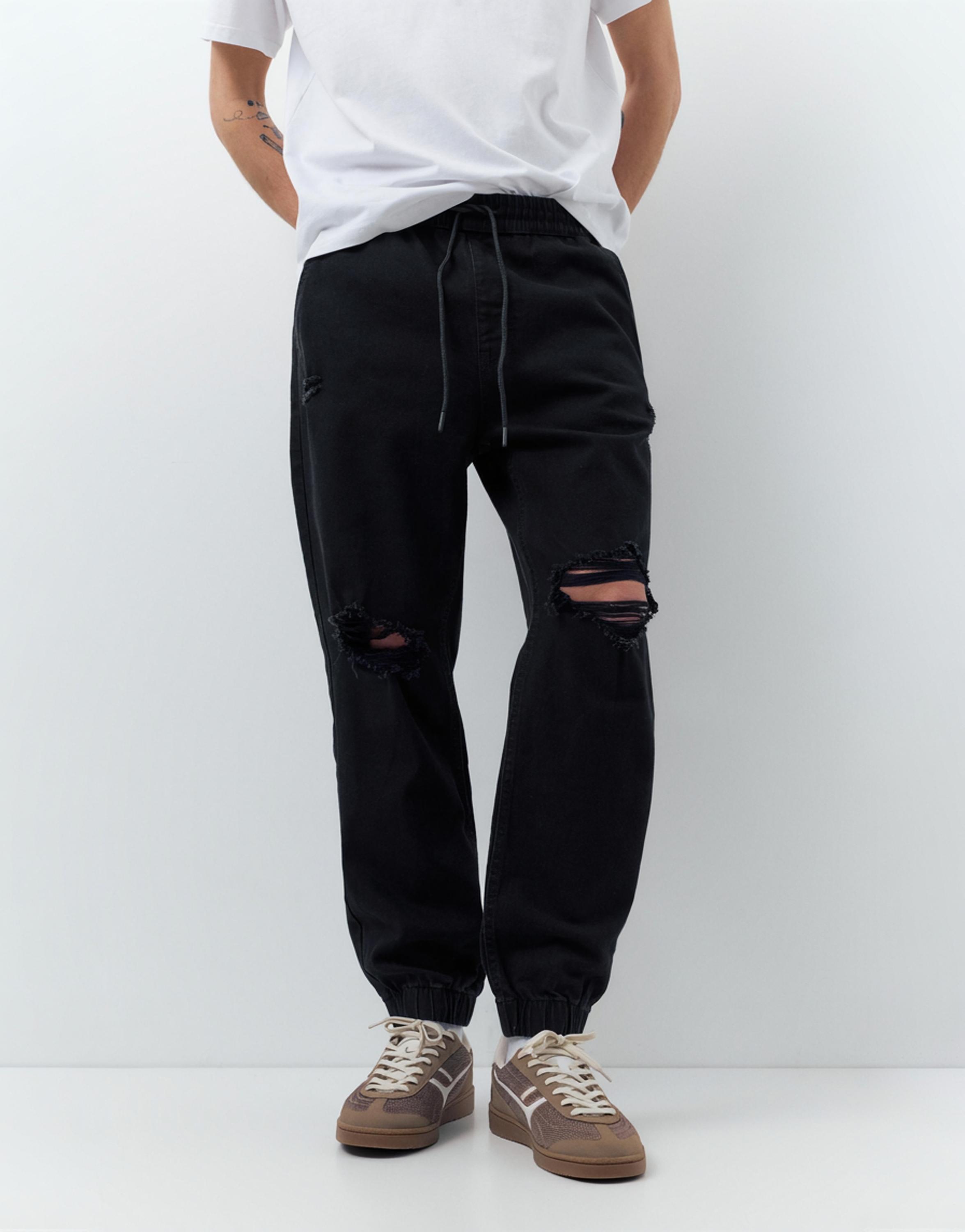 Ripped denim jogger trousers — Black