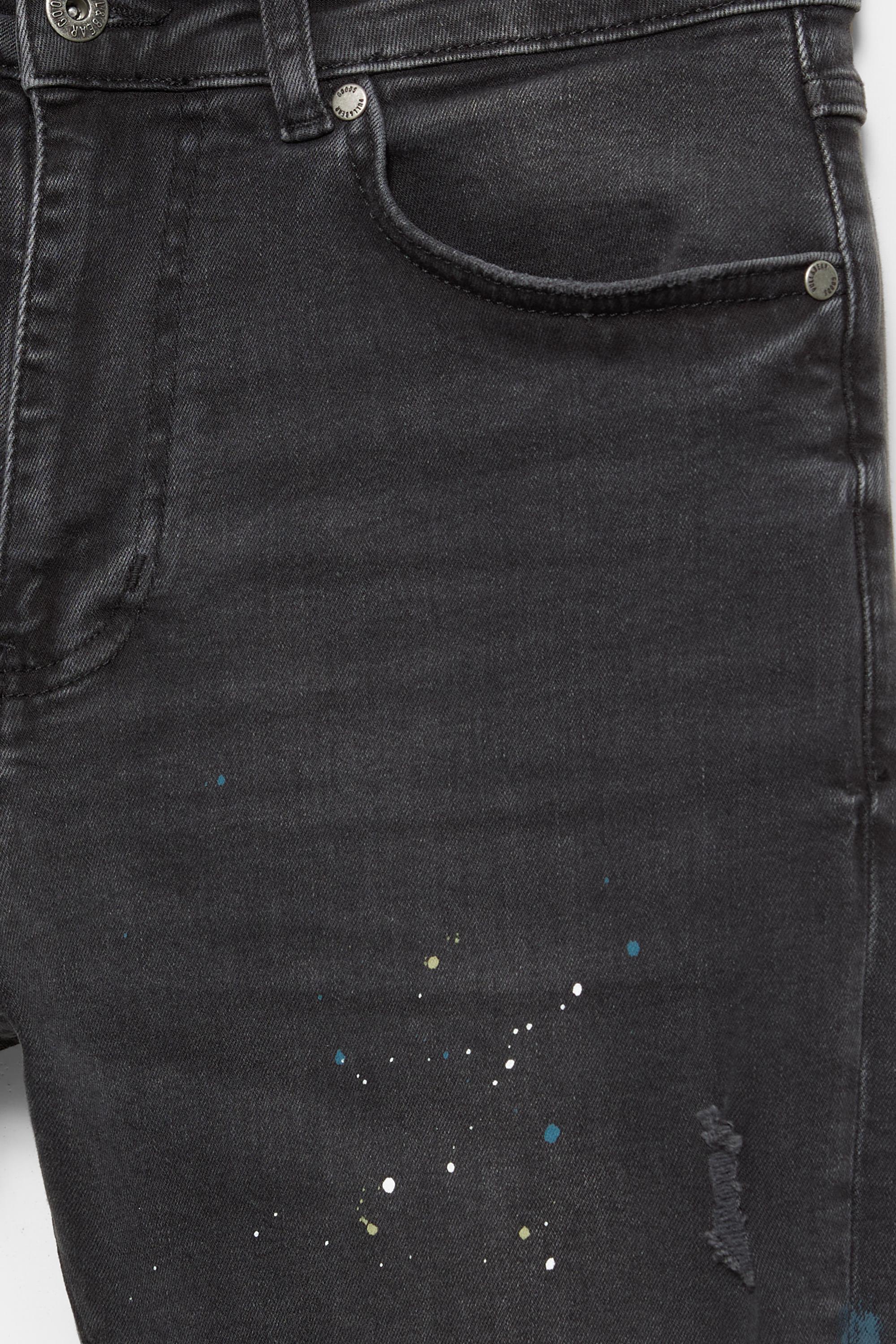 Paint splatter carrot-fit jeans — Faded black