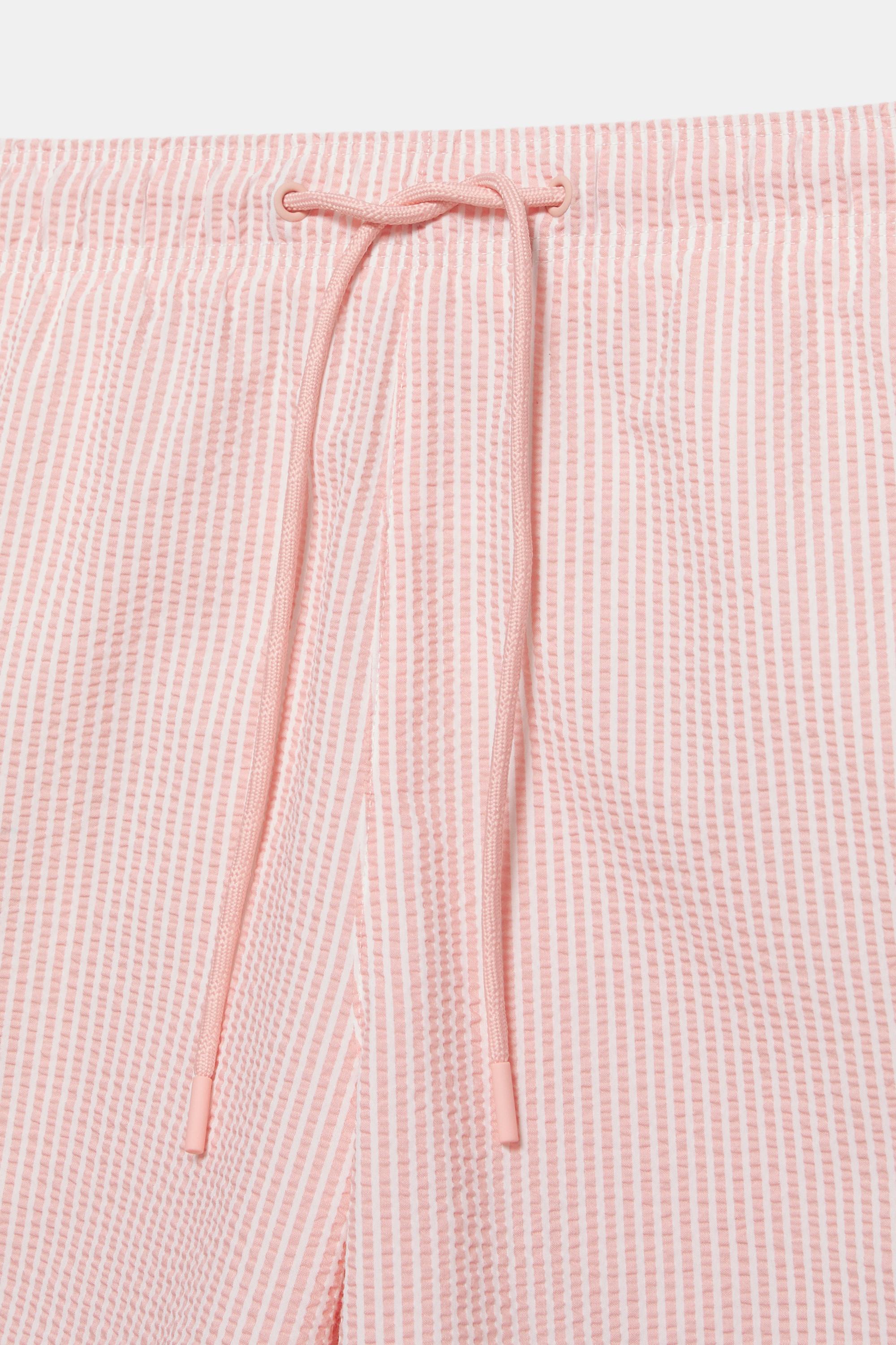 Striped seersucker swimming trunks — Pink
