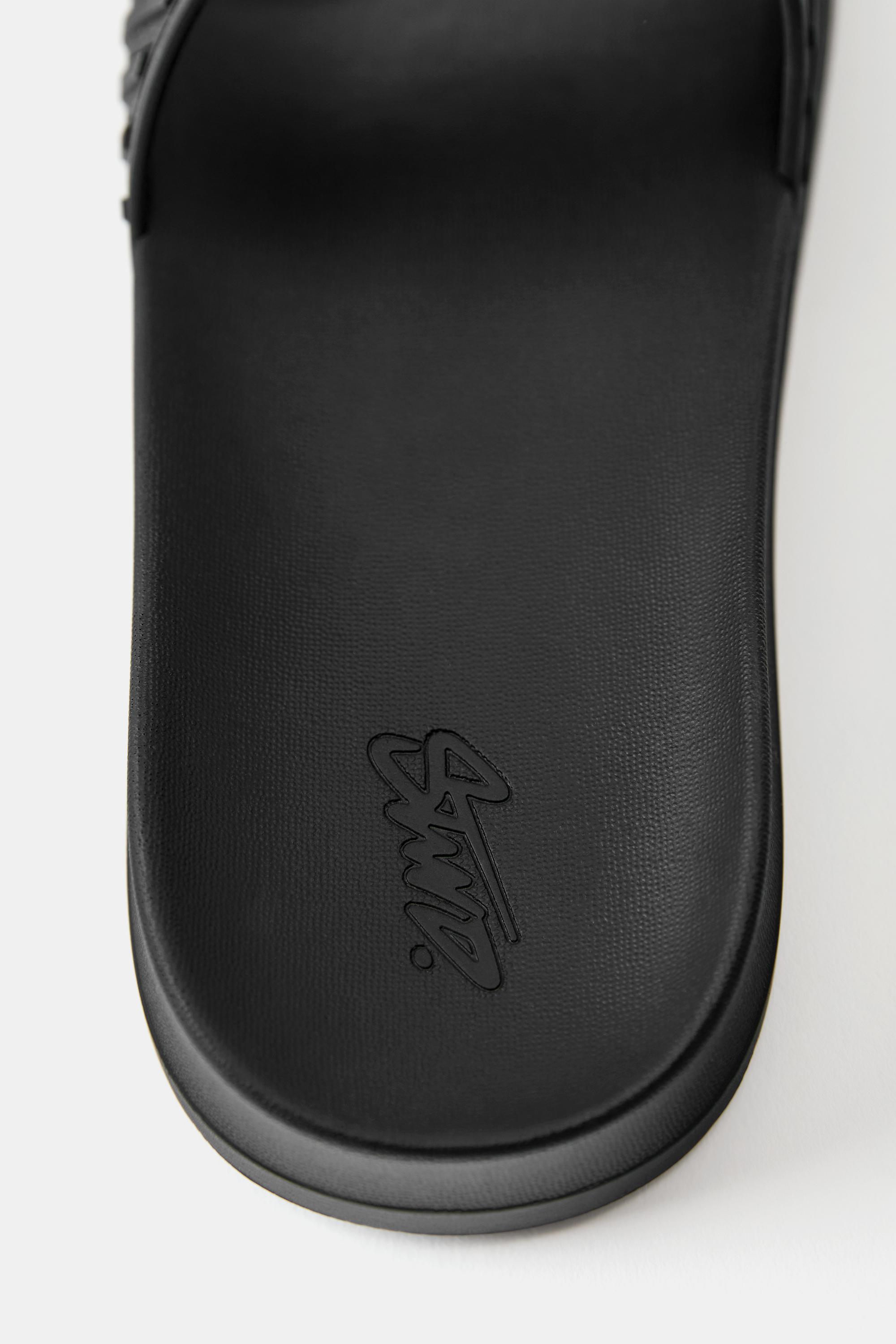 STWD rubberised sandals — Black