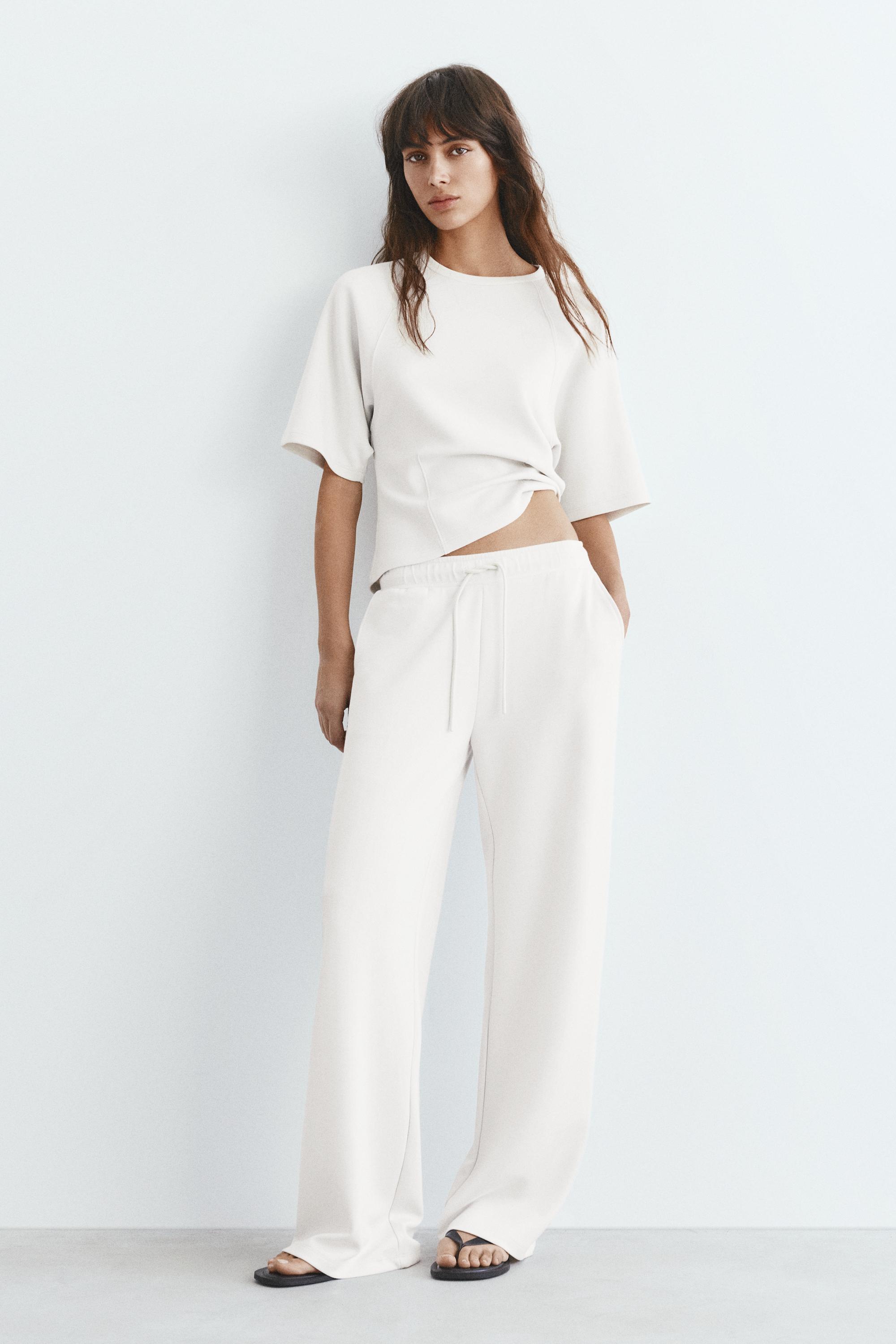 Soft-touch wide-leg trousers — Ecru