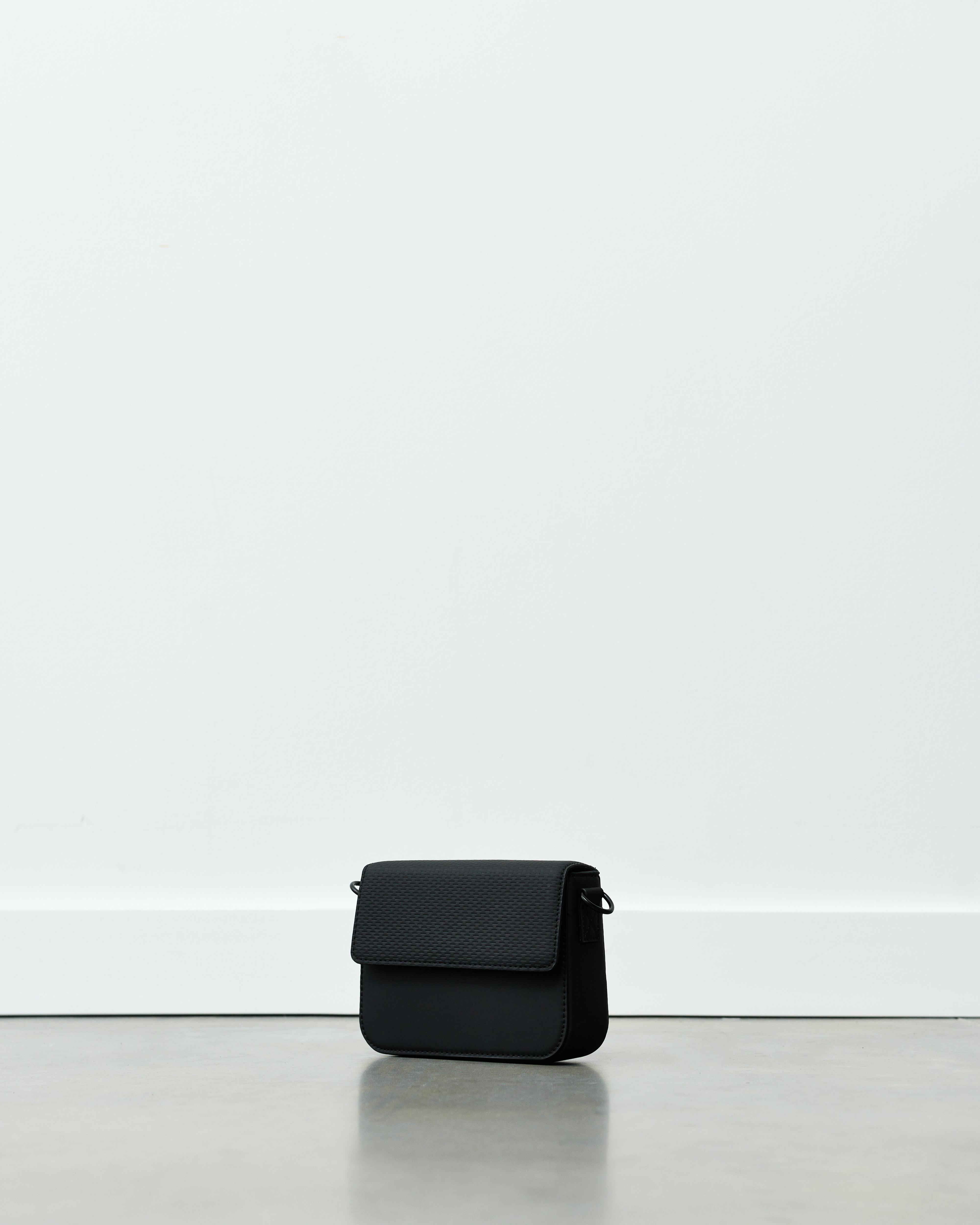 Rubberised textured crossbody bag — Black