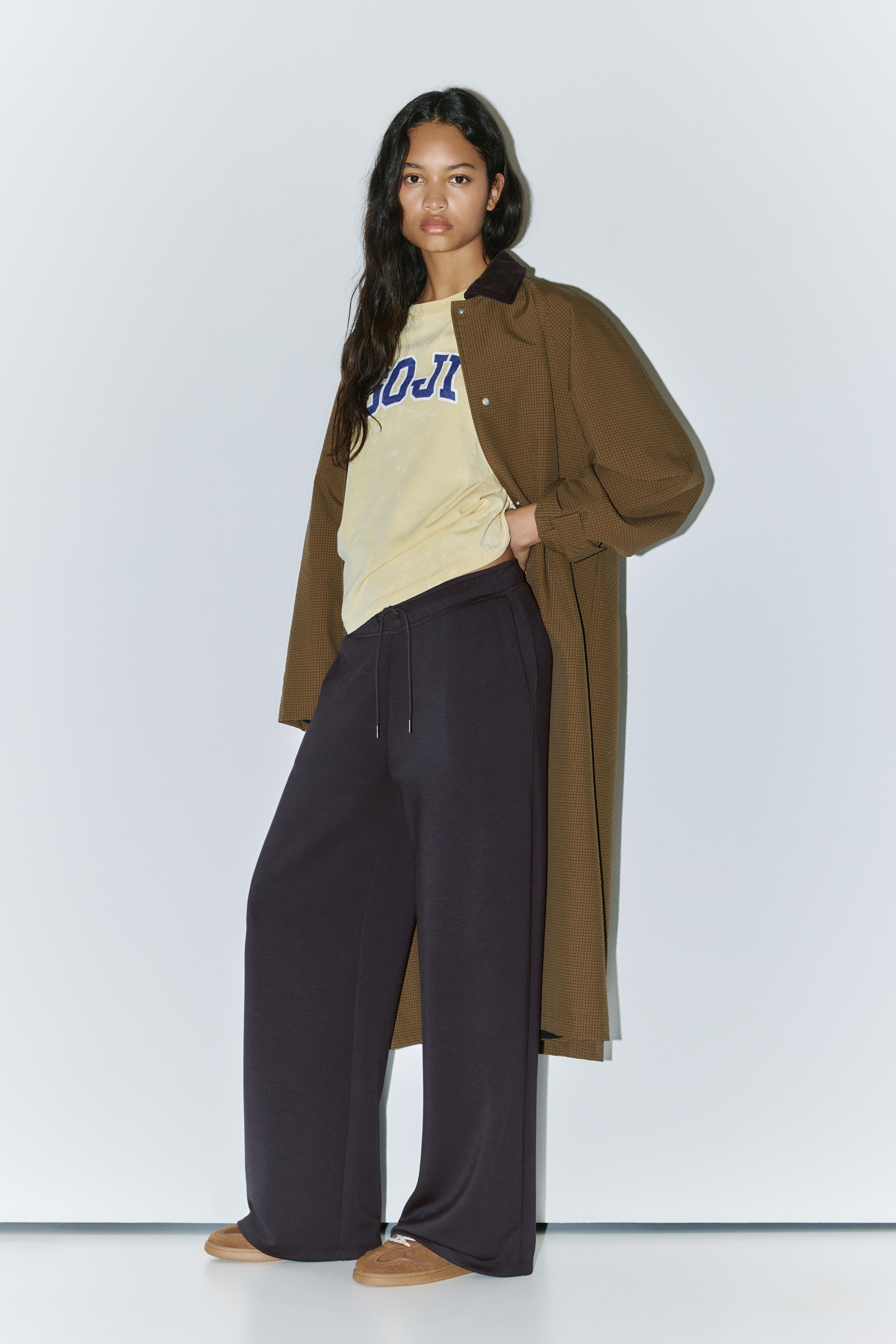 Soft-touch wide-leg trousers — Black