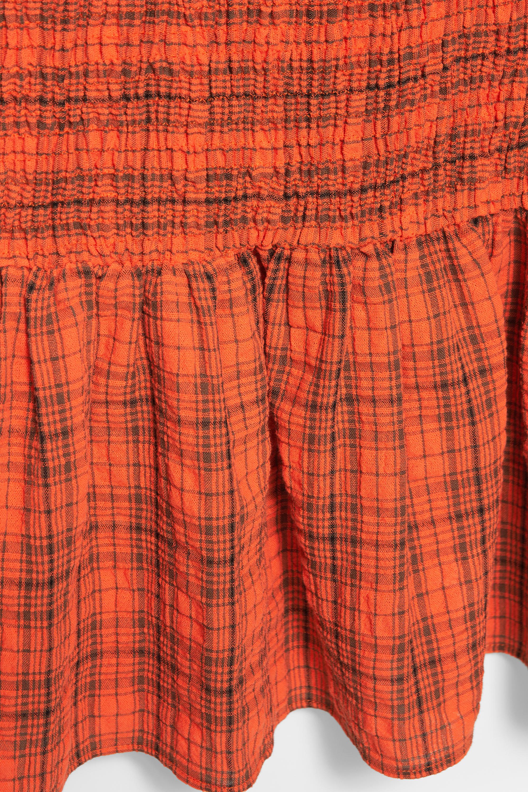 Check smocked dress — Red