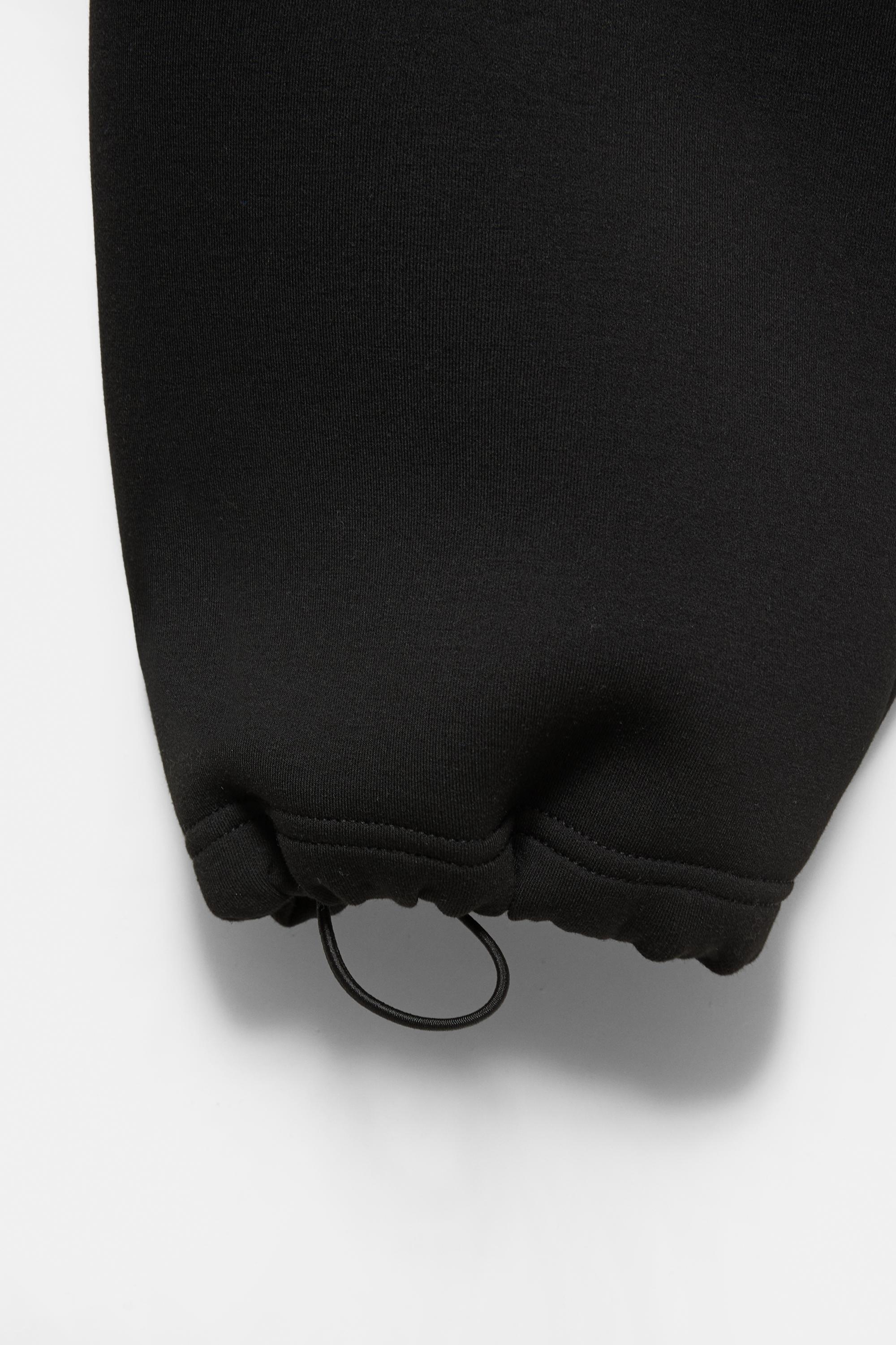 Neoprene-effect baggy trousers — Black