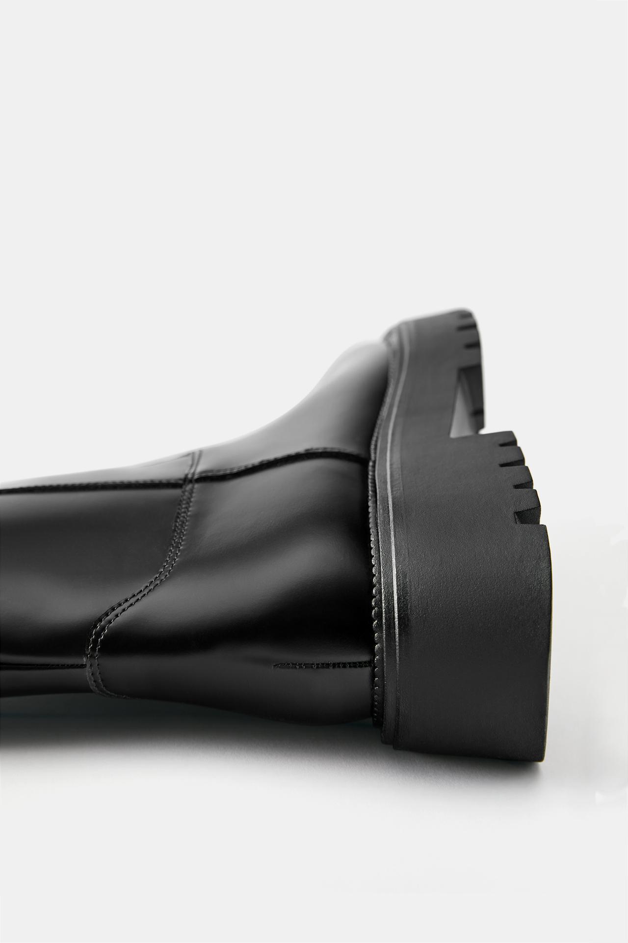 Flat high-leg boots — Black