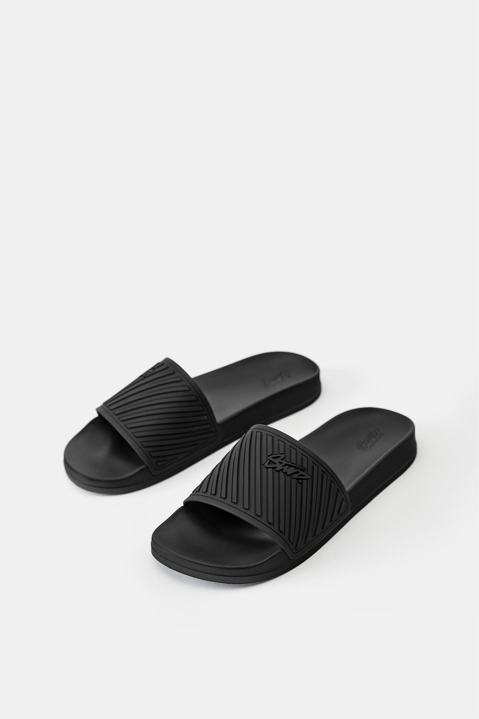 STWD rubberised sandals — Black
