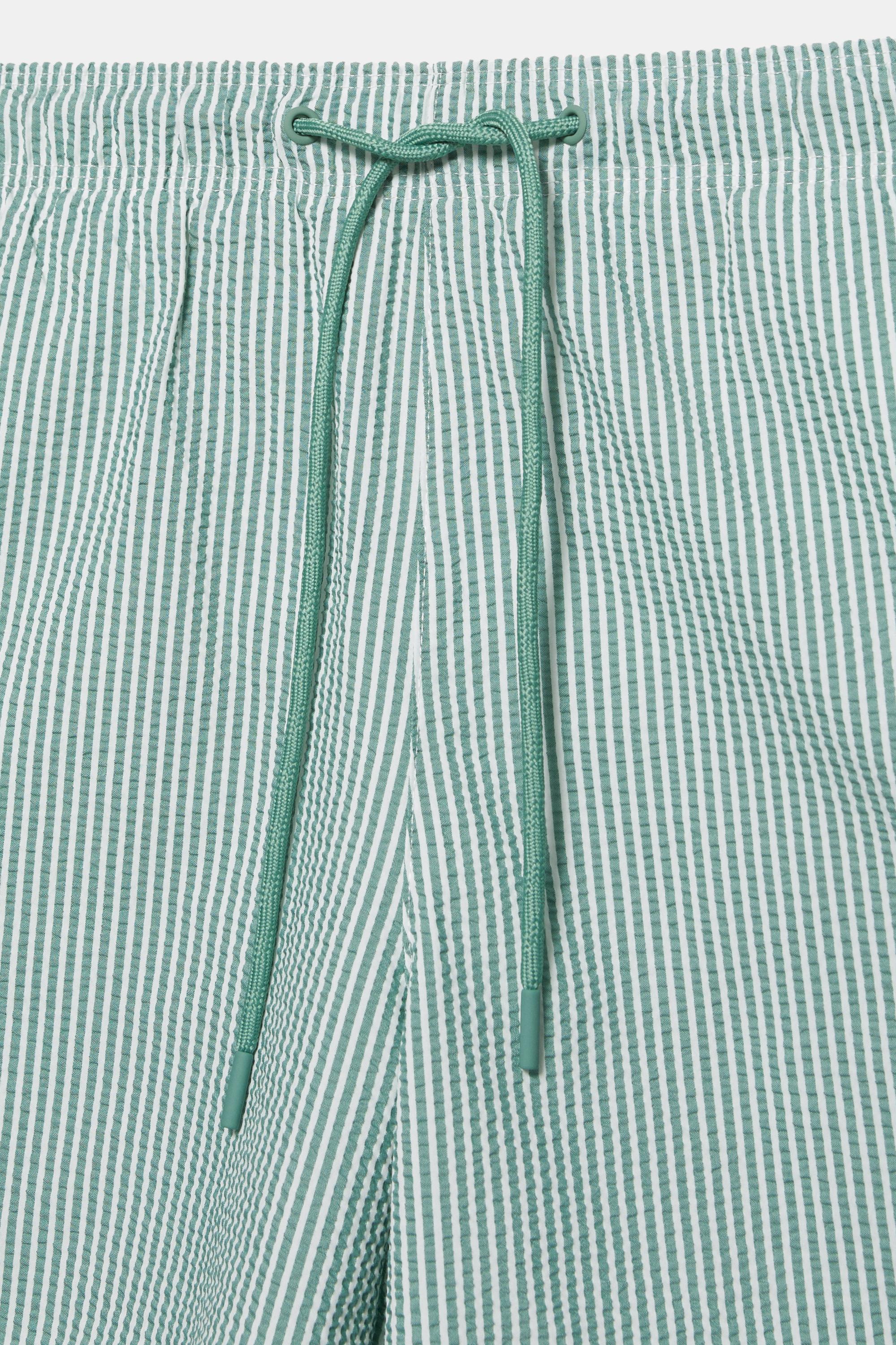 Striped seersucker swimming trunks — Green