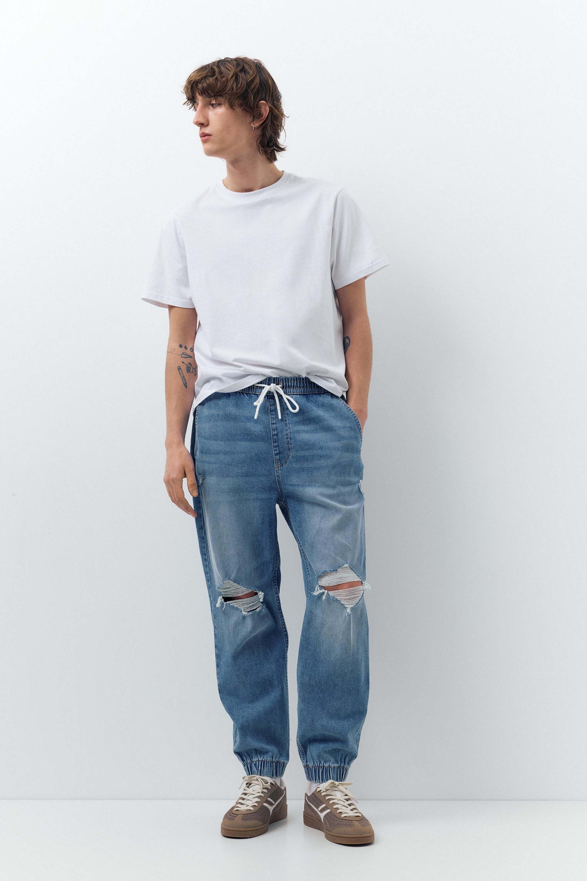 Ripped denim jogger trousers — Pale indigo