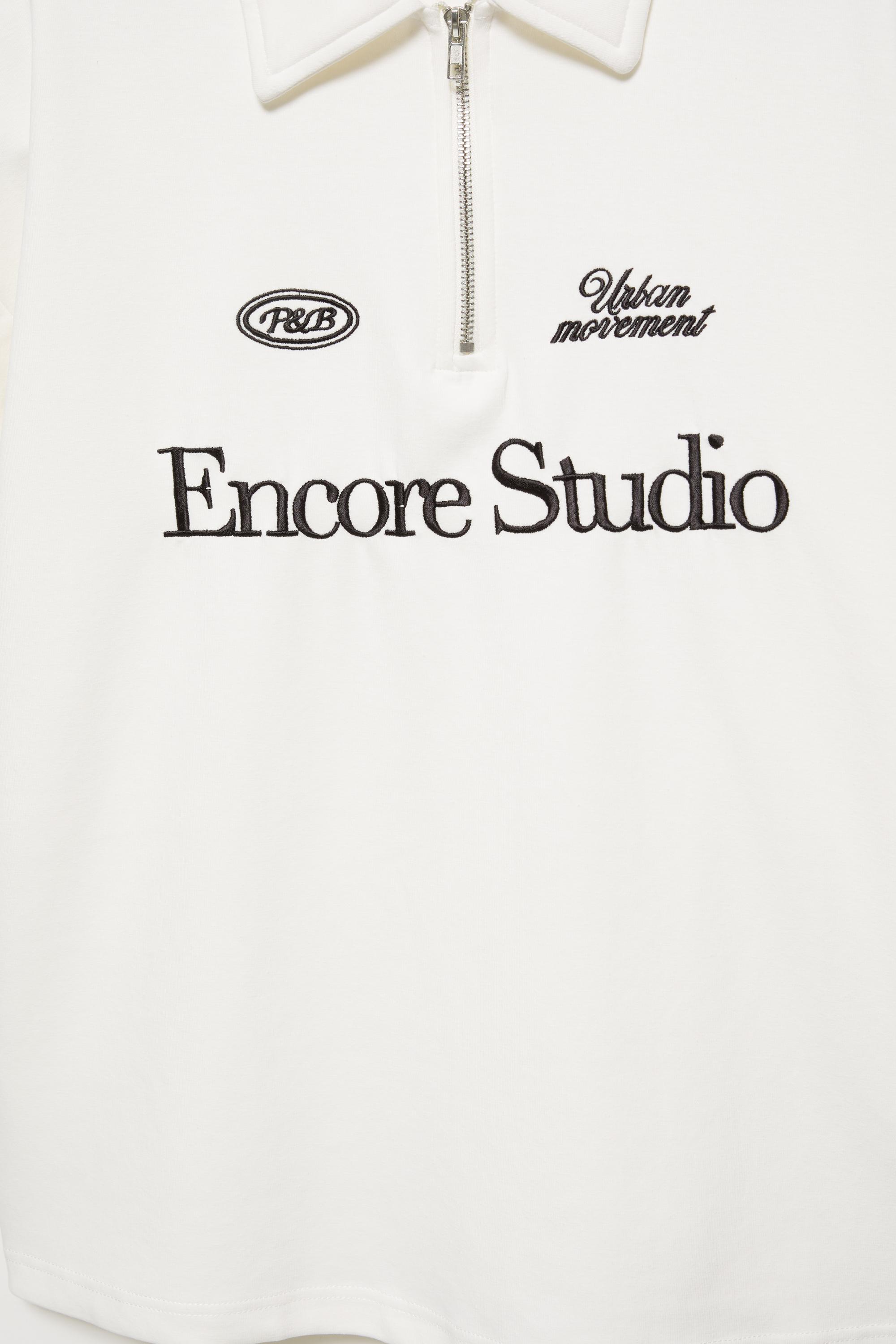 Graphic zip-up interlock polo shirt — Off white
